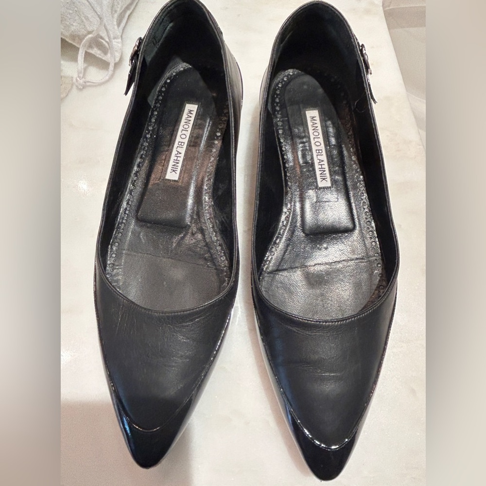 Manolo Blahnik flats.